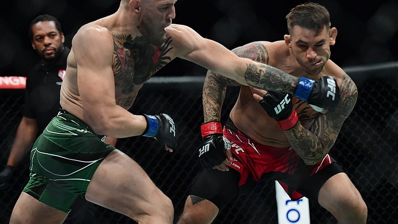 Jul 10, 2021; Las Vegas, Nevada, USA; Conor McGregor moves in for a hit against Dustin Poirier during UFC 264 at T-Mobile Arena. Mandatory Credit: Gary A. Vasquez-USA TODAY Sports