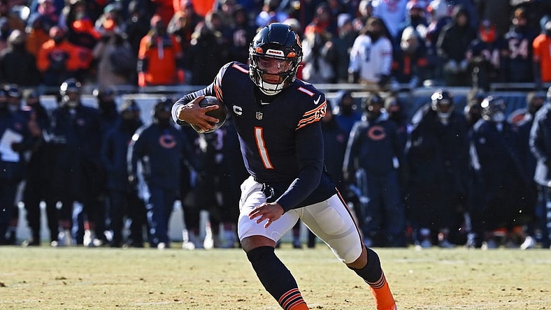 Dec 24, 2022; Chicago, Illinois, USA;  Chicago Bears quarterback Justin Fields (1) runs with the ball against the Buffalo Bills at Soldier Field. Mandatory Credit: Jamie Sabau-USA TODAY Sports
