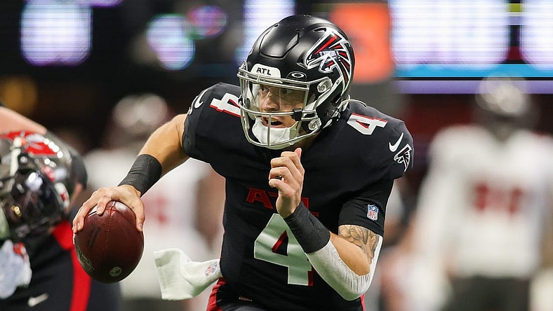 Jan 8, 2023; Atlanta, Georgia, USA; Atlanta Falcons quarterback Desmond Ridder (4) scrambles against the Tampa Bay Buccaneers in the second quarter at Mercedes-Benz Stadium. Mandatory Credit: Brett Davis-USA TODAY Sports