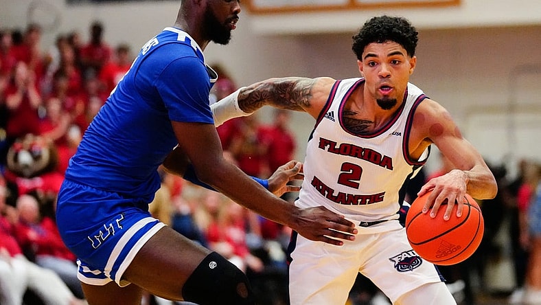 Jan 26, 2023; Boca Raton, Florida, USA; Florida Atlantic Owls guard Nicholas Boyd (2) dribbles past Middle Tennessee Blue Raiders guard Camryn Weston (24) during the second half at Eleanor R. Baldwin Arena. Mandatory Credit: Rich Storry-USA TODAY Sports