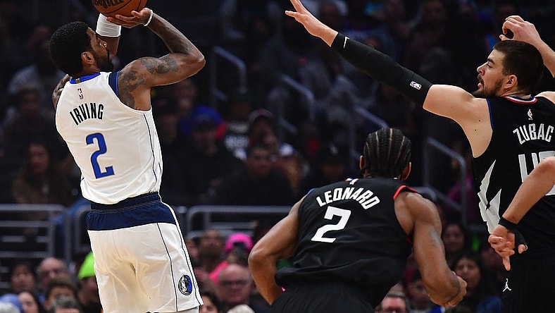 Feb 8, 2023; Los Angeles, California, USA; Dallas Mavericks guard Kyrie Irving (2) shoots against Los Angeles Clippers center Ivica Zubac (40) during the first half at Crypto.com Arena. Mandatory Credit: Gary A. Vasquez-USA TODAY Sports