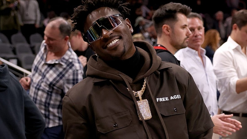 Mar 11, 2022; Atlanta, Georgia, USA; Former Tampa Bay Buccaneers wide receiver Antonio Brown poses for photographers after the game between the Atlanta Hawks and the LA Clippers at State Farm Arena. Mandatory Credit: Jason Getz-USA TODAY Sports