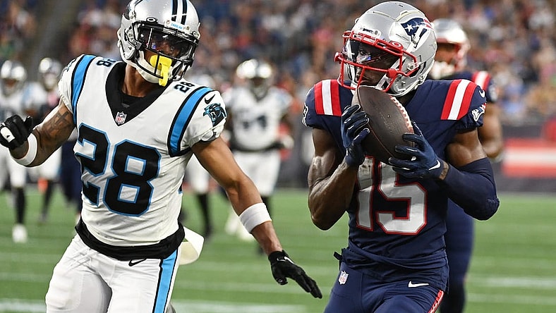 Aug 19, 2022; Foxborough, Massachusetts, USA; New England Patriots wide receiver Nelson Agholor (15) makes a catch with pressure from Carolina Panthers cornerback Keith Taylor Jr. (28) during the first half of a preseason game at Gillette Stadium. Mandatory Credit: Eric Canha-USA TODAY Sports