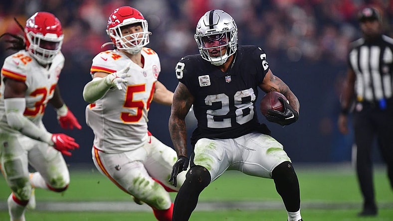 Jan 7, 2023; Paradise, Nevada, USA; Las Vegas Raiders running back Josh Jacobs (28) runs the ball against the Kansas City Chiefs during the second half at Allegiant Stadium. Mandatory Credit: Gary A. Vasquez-USA TODAY Sports