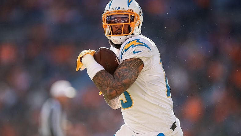 Jan 8, 2023; Denver, Colorado, USA; Los Angeles Chargers wide receiver Keenan Allen (13) catches the ball and runs for a touchdown in the first quarter against the Denver Broncos at Empower Field at Mile High. Mandatory Credit: Isaiah J. Downing-USA TODAY Sports