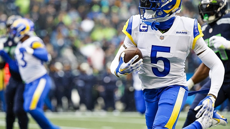 Jan 8, 2023; Seattle, Washington, USA; Los Angeles Rams cornerback Jalen Ramsey (5) returns an interception against the Seattle Seahawks during the first quarter at Lumen Field. Mandatory Credit: Joe Nicholson-USA TODAY Sports