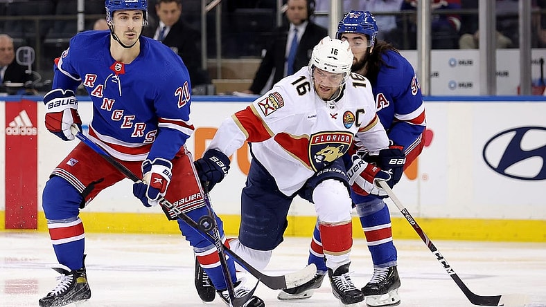 Jan 23, 2023; New York, New York, USA; Florida Panthers center Aleksander Barkov (16) fights for the puck against New York Rangers left wing Chris Kreider (20) and center Mika Zibanejad (93) during the second period at Madison Square Garden. Mandatory Credit: Brad Penner-USA TODAY Sports