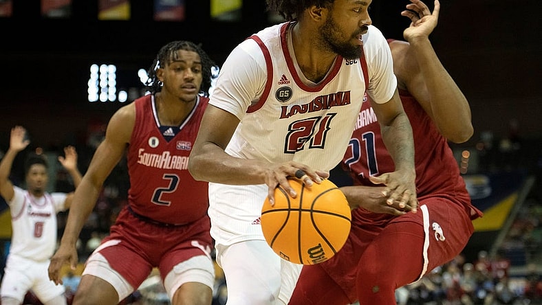 Louisiana's Jordan Brown (No. 21) takes it to the board during Monday's SBC Men's Championship game at the Pensacola Bay Center.
Sbc Men S Basketball Usa Vs Louisiana