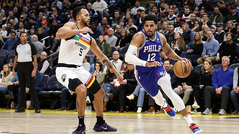 Mar 7, 2023; Minneapolis, Minnesota, USA; Philadelphia 76ers forward Tobias Harris (12) drives while Minnesota Timberwolves forward Kyle Anderson (5) defends during the second quarter at Target Center. Mandatory Credit: Matt Krohn-USA TODAY Sports