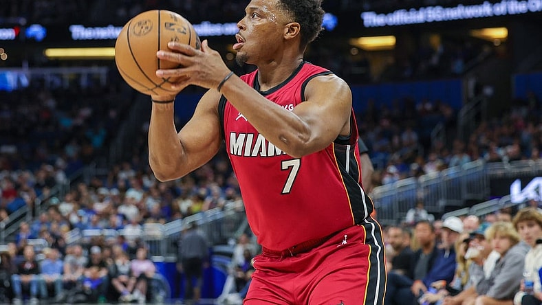 Mar 11, 2023; Orlando, Florida, USA; Miami Heat guard Kyle Lowry (7) shoots the ball against the Orlando Magic during the first quarter at Amway Center. Mandatory Credit: Mike Watters-USA TODAY Sports
