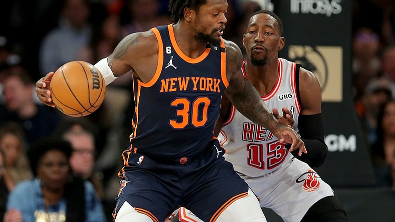 Mar 29, 2023; New York, New York, USA; New York Knicks forward Julius Randle (30) controls the ball against Miami Heat center Bam Adebayo (13) during the first quarter at Madison Square Garden. Mandatory Credit: Brad Penner-USA TODAY Sports