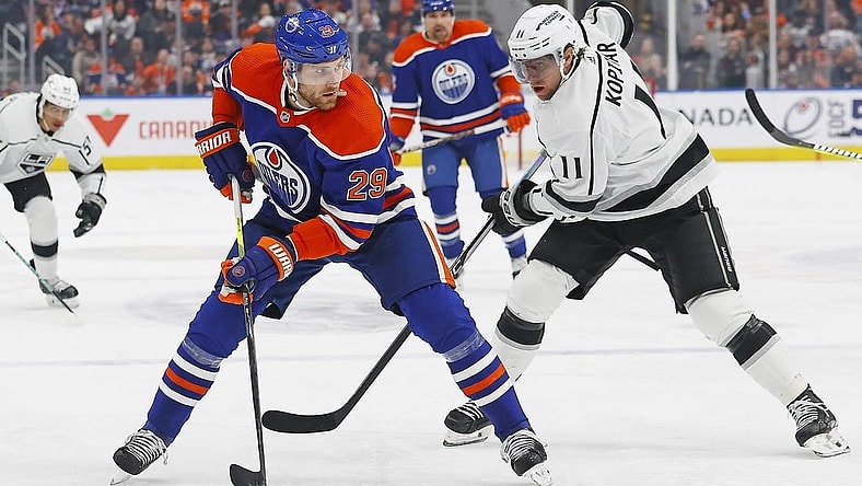 Mar 30, 2023; Edmonton, Alberta, CAN; Edmonton Oilers forward Leon Draisaitl (29) protects the puck from Los Angeles Kings forward Anze Kopitar (11) during the first period at Rogers Place. Mandatory Credit: Perry Nelson-USA TODAY Sports