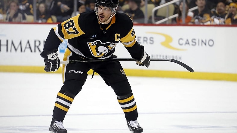 Apr 2, 2023; Pittsburgh, Pennsylvania, USA; Pittsburgh Penguins center Sidney Crosby (87) prepares to take a face-off against the Philadelphia Flyers during the third period at PPG Paints Arena. The Penguins won 4-2. Mandatory Credit: Charles LeClaire-USA TODAY Sports
