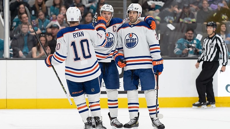Apr 8, 2023; San Jose, California, USA;  Edmonton Oilers center Derek Ryan (10) celebrates with center Connor McDavid (97) and defenseman Evan Bouchard (2) during the first period against the San Jose Sharks at SAP Center at San Jose. Mandatory Credit: Stan Szeto-USA TODAY Sports