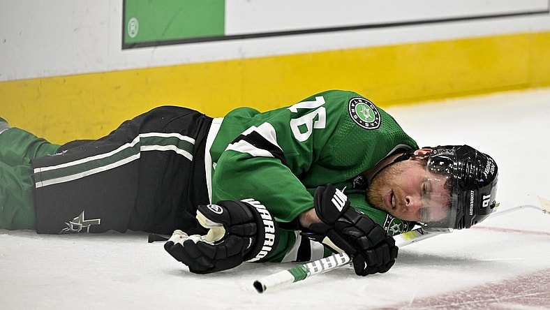 Apr 17, 2023; Dallas, Texas, USA; Dallas Stars center Joe Pavelski (16) lies on the ice after getting hit by Minnesota Wild defenseman Matt Dumba (not pictured) during the second period in game one of the first round of the 2023 Stanley Cup Playoffs at the American Airlines Center. Mandatory Credit: Jerome Miron-USA TODAY Sports