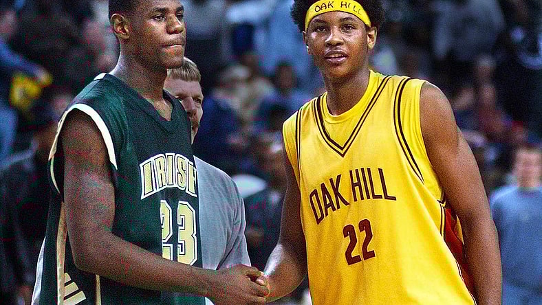 After 19 seasons, Carmelo Anthony retired from the NBA on Monday. Pictured here as a senior at Oak Hill with high school junior LeBron James.
