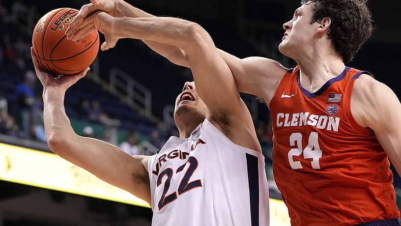 Mar 10, 2023; Greensboro, NC, USA; Virginia Cavaliers center Francisco Caffaro (22) shoots as Clemson Tigers center PJ Hall (24) defends in the second half during the semifinals of the ACC Tournament at Greensboro Coliseum. Mandatory Credit: Bob Donnan-USA TODAY Sports