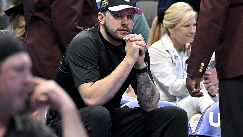 Apr 9, 2023; Dallas, Texas, USA; Dallas Mavericks guard Luka Doncic (77) sits by himself during a timeout in the game between the Dallas Mavericks and the San Antonio Spurs at the American Airlines Center. Mandatory Credit: Jerome Miron-USA TODAY Sports