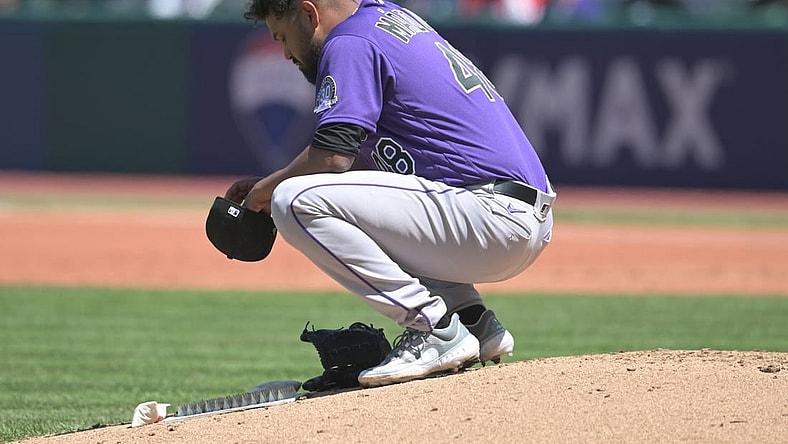 Apr 26, 2023; Cleveland, Ohio, USA; Colorado Rockies starting pitcher German Marquez (48) crouches on the mound before leaving the game during the fourth inning against the Cleveland Guardians at Progressive Field. Mandatory Credit: Ken Blaze-USA TODAY Sports