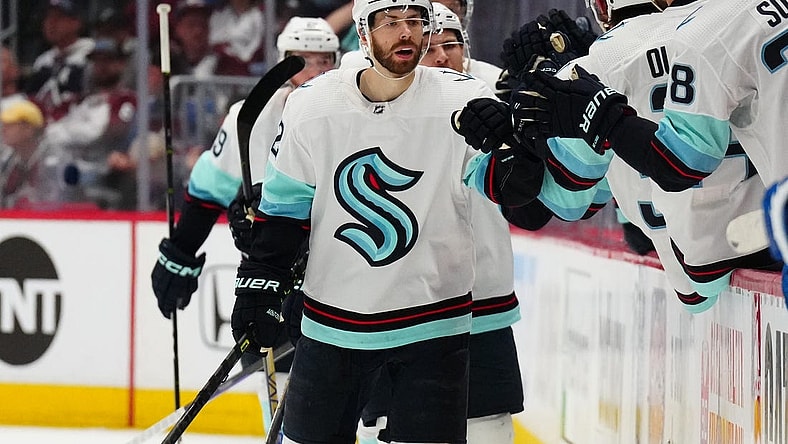 Apr 30, 2023; Denver, Colorado, USA; Seattle Kraken right wing Oliver Bjorkstrand (22) celebrates his goal in the second period against the Colorado Avalanche in game seven of the first round of the 2023 Stanley Cup Playoffs at Ball Arena. Mandatory Credit: Ron Chenoy-USA TODAY Sports