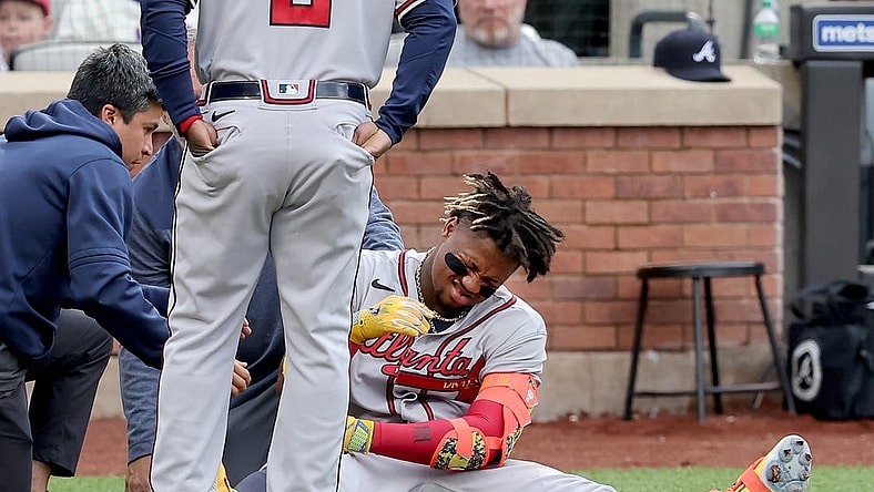 May 1, 2023; New York City, New York, USA; Atlanta Braves right fielder Ronald Acuna Jr. (13) reacts after being hit by a pitch during the first inning against the New York Mets at Citi Field. Acuna left the game for a pinch runner. Mandatory Credit: Brad Penner-USA TODAY Sports