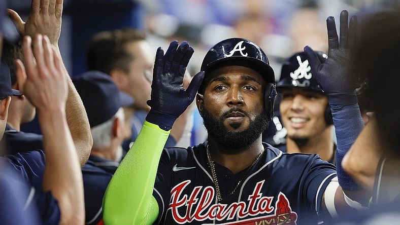 May 3, 2023; Miami, Florida, USA; Atlanta Braves designated hitter Marcell Ozuna (20) celebrates with teammates after hitting a grand slam during the second inning against the Miami Marlins at loanDepot Park. Mandatory Credit: Sam Navarro-USA TODAY Sports