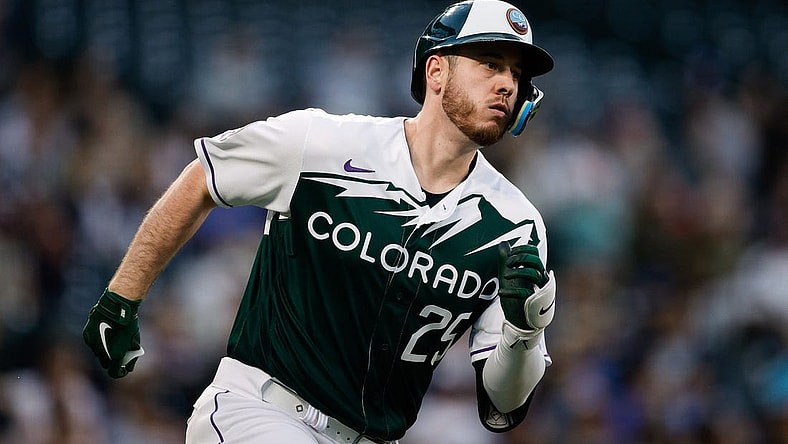 May 3, 2023; Denver, Colorado, USA; Colorado Rockies first baseman C.J. Cron (25) runs to second on a double in the fourth inning against the Milwaukee Brewers at Coors Field. Mandatory Credit: Isaiah J. Downing-USA TODAY Sports