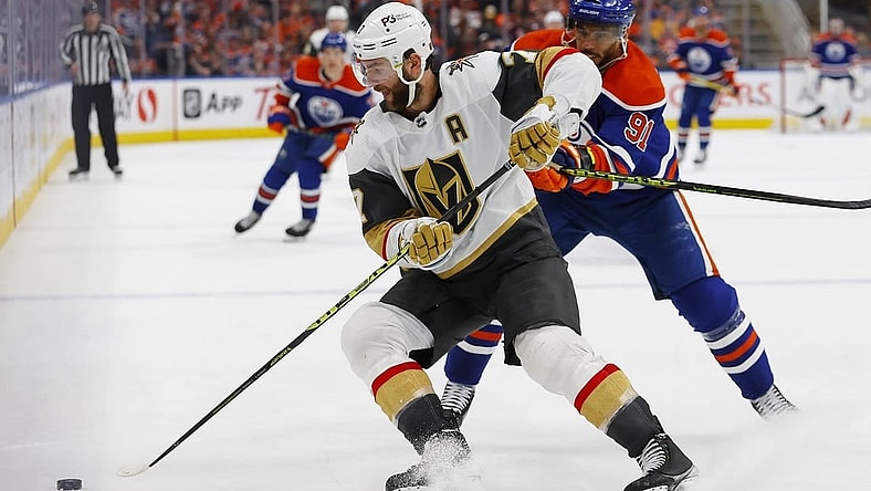 May 10, 2023; Edmonton, Alberta, CAN; Vegas Golden Knights defensemen Alex Pietrangelo (7) looks to move the puck in front of Edmonton Oilers forward Evander Kane (91) during the third period in game four of the second round of the 2023 Stanley Cup Playoffs at Rogers Place. Mandatory Credit: Perry Nelson-USA TODAY Sports