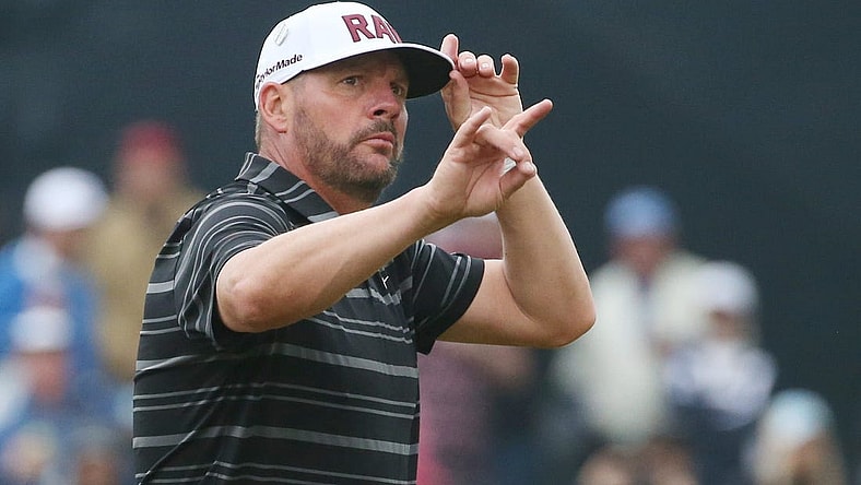 Michael Block tips his hat and waves to the loud supportive crowd following his par on the 18th hole during the third round at the PGA Championship at Oak Hill Country Club Saturday, May 20, 2023.  Block finished the day tied for eighth at even par.
