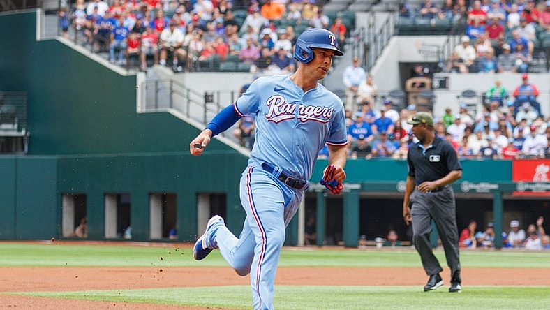 May 21, 2023; Arlington, Texas, USA; Texas Rangers third baseman Josh Jung (6) hits a home run during the second inning against the Colorado Rockies at Globe Life Field. Mandatory Credit: Andrew Dieb-USA TODAY Sports
