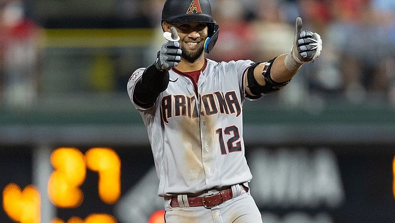 May 22, 2023; Philadelphia, Pennsylvania, USA; Arizona Diamondbacks left fielder Lourdes Gurriel Jr. (12) reacts after his RBI double during the eighth inning against the Philadelphia Phillies at Citizens Bank Park. Mandatory Credit: Bill Streicher-USA TODAY Sports