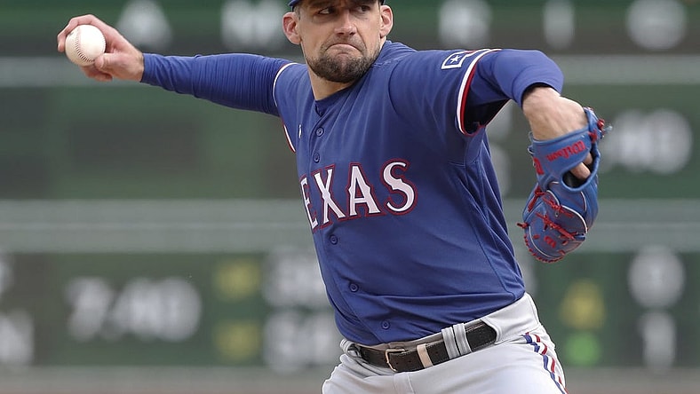 May 23, 2023; Pittsburgh, Pennsylvania, USA; Texas Rangers starting pitcher Nathan Eovaldi (17) delivers a pitch against the Pittsburgh Pirates during the first inning at PNC Park. Mandatory Credit: Charles LeClaire-USA TODAY Sports