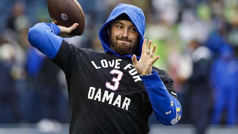 Jan 8, 2023; Seattle, Washington, USA; Los Angeles Rams quarterback Baker Mayfield (17) participates in early pregame warmups against the Seattle Seahawks while wearing a    Love for Damar    t-shirt in honor of Buffalo Bills safety Damar Hamlin (3, not pictured) at Lumen Field. Mandatory Credit: Joe Nicholson-USA TODAY Sports