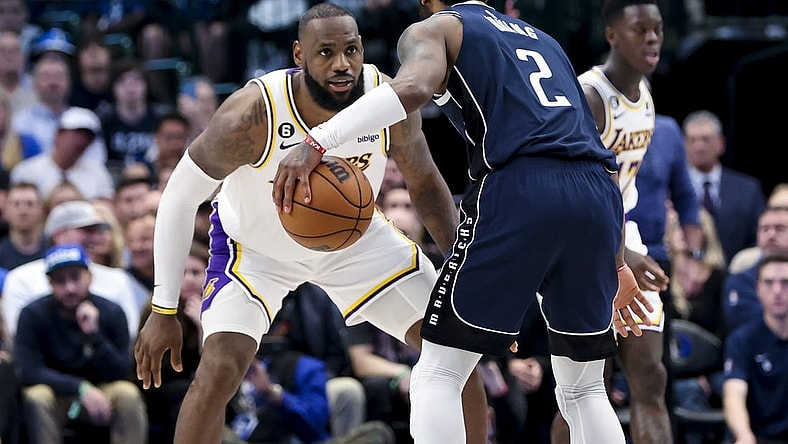 Feb 26, 2023; Dallas, Texas, USA; Los Angeles Lakers forward LeBron James (6) guards Dallas Mavericks guard Kyrie Irving (2) during the fourth quarter at American Airlines Center. Mandatory Credit: Kevin Jairaj-USA TODAY Sports