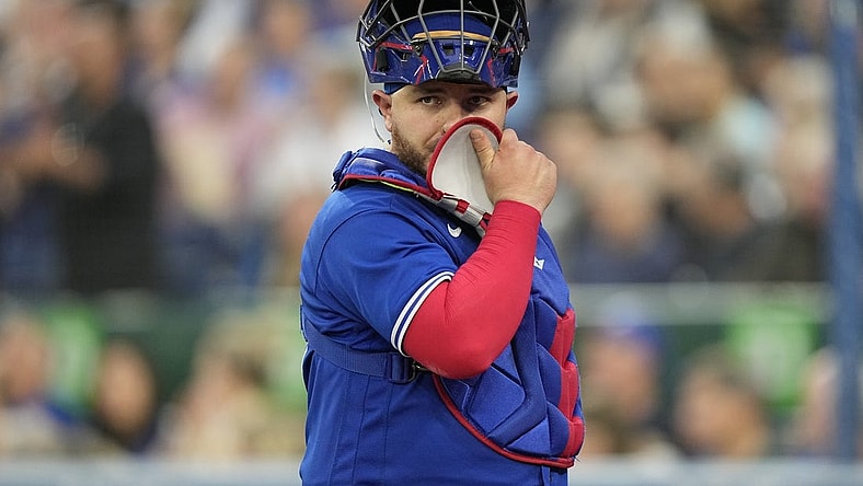 Jun 5, 2023; Toronto, Ontario, CAN; Toronto Blue Jays catcher Alejandro Kirk (30) walks to the dugout at the end of the fourth inning against the Houston Astros at Rogers Centre. Mandatory Credit: John E. Sokolowski-USA TODAY Sports