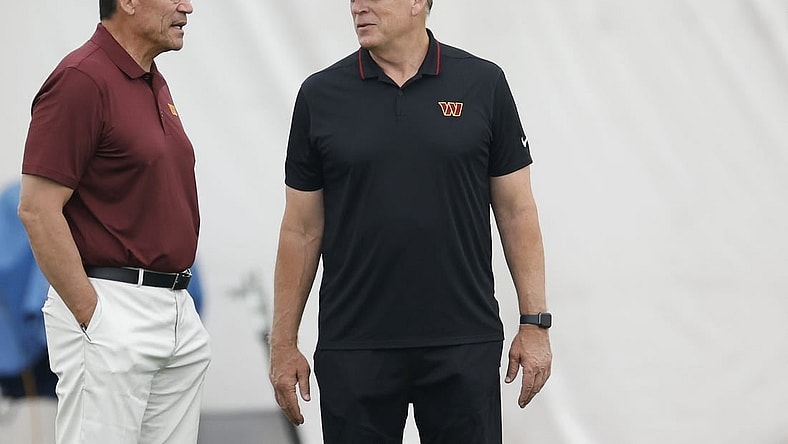 Jun 8, 2023; Ashburn, Virginia, USA; Washington Commanders head coach Ron Rivera (L) talks with Commanders defensive coordinator Jack Del Rio (R) on day three of minicamp at OrthoVirginia Training Center at Commanders Park, held inside the training bubble due to poor air quality from Canadian wildfire smoke in Ashburn. Mandatory Credit: Geoff Burke-USA TODAY Sports