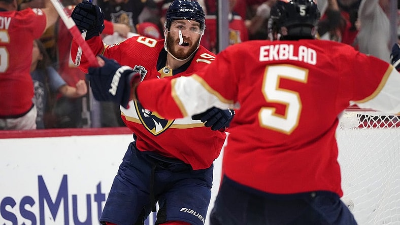 Jun 8, 2023; Sunrise, Florida, USA; (Editors Notes: Caption Correction) Florida Panthers left wing Matthew Tkachuk (19) and defenseman Aaron Ekblad (5) celebrate the game winning goal scored by defenseman Brandon Montour (not pictured) against the Vegas Golden Knights Florida Panthers during overtime in game three of the 2023 Stanley Cup Final at FLA Live Arena. Mandatory Credit: Jasen Vinlove-USA TODAY Sports