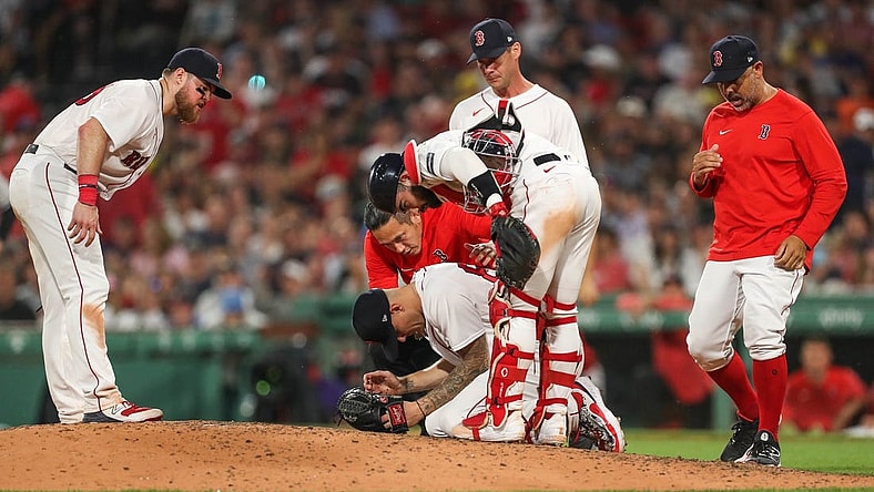 Jun 16, 2023; Boston, Massachusetts, USA; Boston Red Sox starting pitcher Tanner Houck (89) reacts after getting hit in the face with a line drive during the fifth inning against the New York Yankees at Fenway Park. Mandatory Credit: Paul Rutherford-USA TODAY Sports