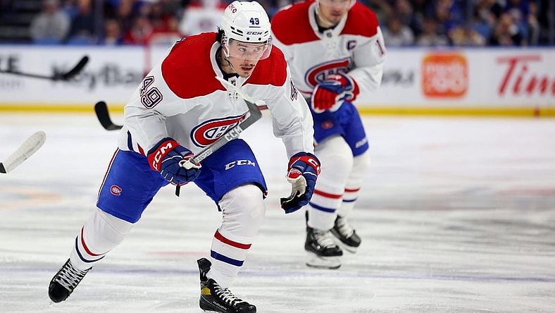 Mar 27, 2023; Buffalo, New York, USA;  Montreal Canadiens left wing Rafael Harvey-Pinard (49) skates for a loose puck during the first period against the Buffalo Sabres at KeyBank Center. Mandatory Credit: Timothy T. Ludwig-USA TODAY Sports