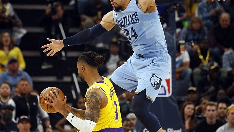 Apr 26, 2023; Memphis, Tennessee, USA; Memphis Grizzlies forward Dillon Brooks (24) defends Los Angeles Lakers guard D'Angelo Russell (1) during the second half during game five of the 2023 NBA playoffs at FedExForum. Mandatory Credit: Petre Thomas-USA TODAY Sports