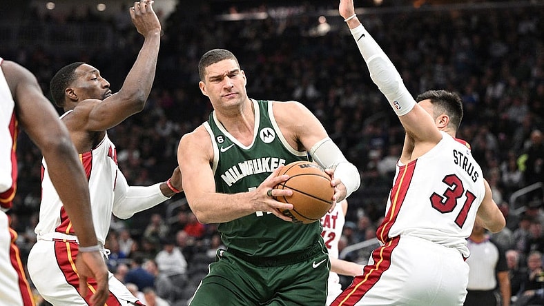 Apr 26, 2023; Milwaukee, Wisconsin, USA; Milwaukee Bucks center Brook Lopez (11) drives against Miami Heat during game five of the 2023 NBA Playoffs at Fiserv Forum. Mandatory Credit: Michael McLoone-USA TODAY Sports