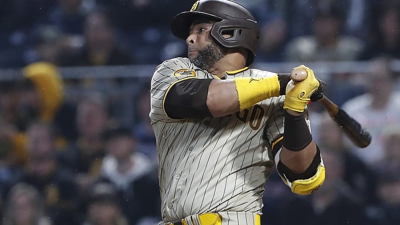 Jun 27, 2023; Pittsburgh, Pennsylvania, USA;  San Diego Padres designated hitter Nelson Cruz (32) hits a RBI single against the Pittsburgh Pirates during the sixth inning at PNC Park. Mandatory Credit: Charles LeClaire-USA TODAY Sports