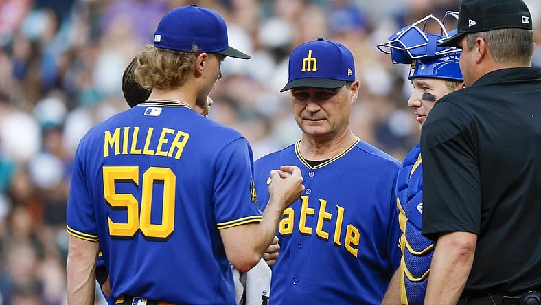 Jun 30, 2023; Seattle, Washington, USA; Seattle Mariners manager Scott Servais (middle) talks with starting pitcher Bryce Miller (50) during a potential injury analysis in the third inning against the Tampa Bay Rays at T-Mobile Park. Mandatory Credit: Joe Nicholson-USA TODAY Sports