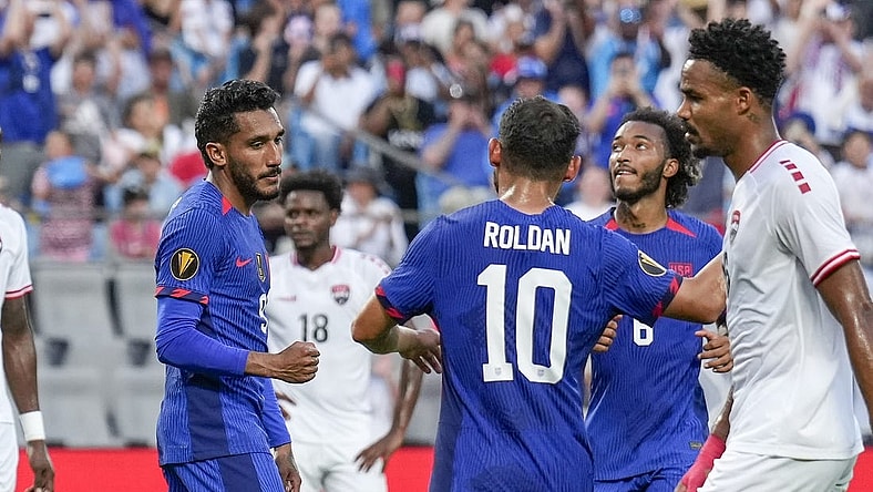 Jul 2, 2023; Charlotte, North Carolina, USA; United States midfielder Cristian Roldan (10) congratulates forward Jesus Ferreira (9) after his goal against the Trinidad and Tobago during the first half at Bank of America Stadium. Mandatory Credit: Jim Dedmon-USA TODAY Sports