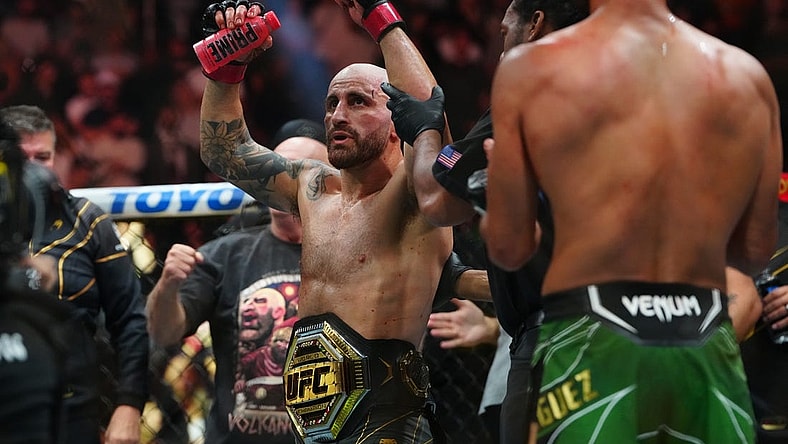 Jul 8, 2023; Las Vegas, Nevada, USA; Alexander Volkanovski (red gloves) reacts after defeating Yair Rodriguez (blue gloves) during UFC 290 at T-Mobile Arena. Mandatory Credit: Stephen R. Sylvanie-USA TODAY Sports