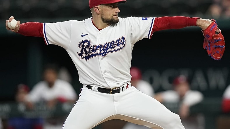 Jul 18, 2023; Arlington, Texas, USA; Texas Rangers starting pitcher Nathan Eovaldi (17) delivers a pitch to the Tampa Bay Rays during the first inning at Globe Life Field. Mandatory Credit: Jim Cowsert-USA TODAY Sports