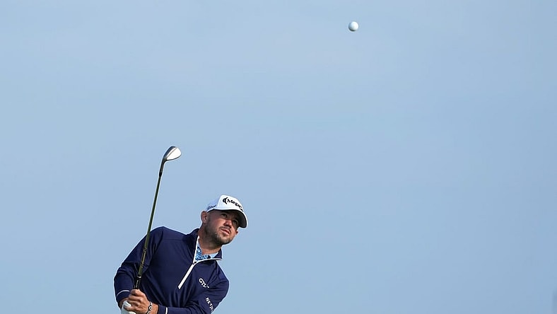 July 20, 2023; Hoylake, England, GBR; Brian Harman plays a shot onto the 17th green during the first round of The Open Championship golf tournament at Royal Liverpool. Mandatory Credit: Kyle Terada-USA TODAY Sports