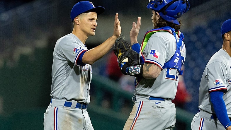 May 3, 2022; Philadelphia, Pennsylvania, USA; Texas Rangers shortstop Corey Seager (5) and catcher Jonah Heim (28) high five after a victory against the Philadelphia Phillies at Citizens Bank Park. Mandatory Credit: Bill Streicher-USA TODAY Sports