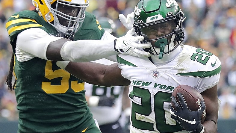 Oct 16, 2022; Green Bay, Wisconsin, USA; Green Bay Packers linebacker De'Vondre Campbell (59) chases New York Jets running back Breece Hall (20) during the second half at Lambeau Field. Mandatory Credit: Wm. Glasheen/Appleton Post-Crescent-USA TODAY NETWORK