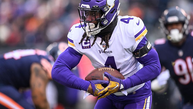 Jan 8, 2023; Chicago, Illinois, USA; Minnesota Vikings running back Dalvin Cook (4) runs the ball during the first quarter against the Chicago Bears at Soldier Field. Mandatory Credit: Daniel Bartel-USA TODAY Sports